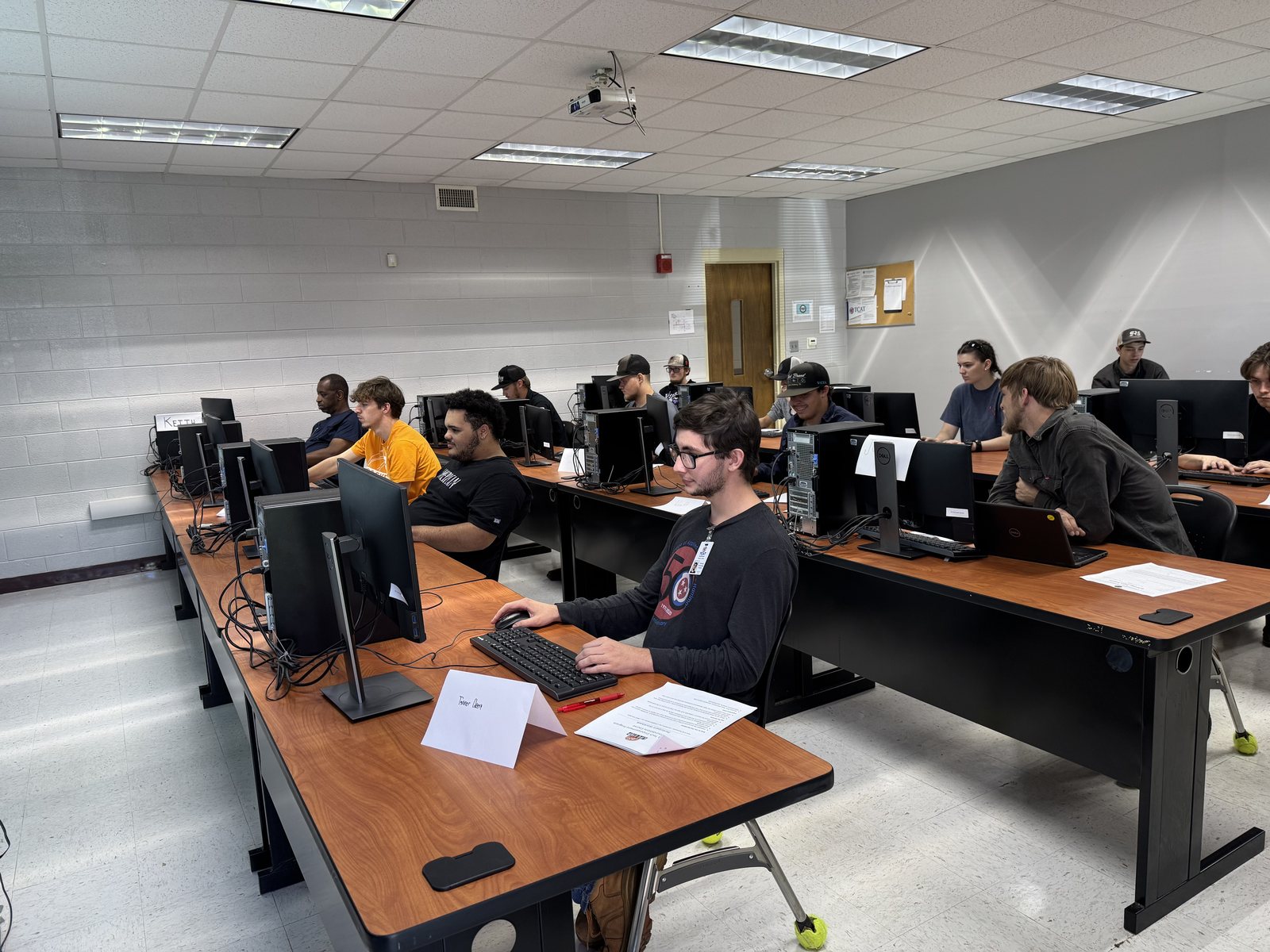 Participants working in a computer lab class
